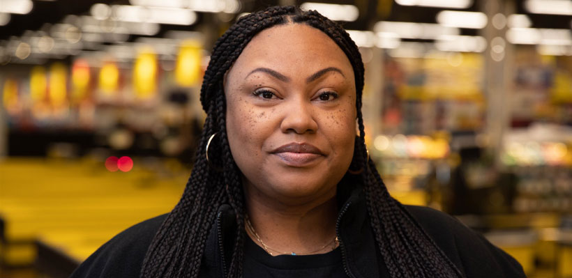 Grocery worker Natasha pictured at work. 