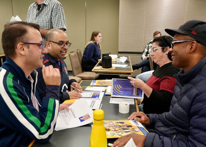 Edward Brown (right) meets with UFCW members to discuss issues being brought forward to MPPs.