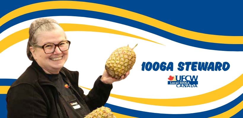 Union Steward Marike holding a pineapple. 